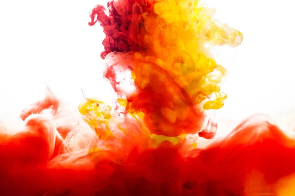 Yellow and red Inks in water — Stock Photo, Image