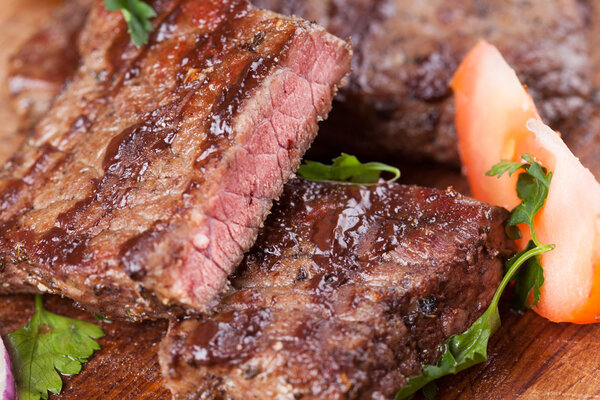 Close-up of Delicious beef steak on a wooden background