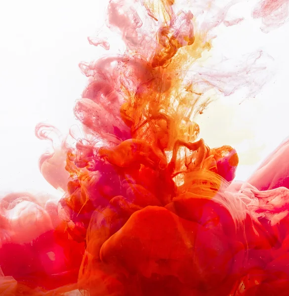 Yellow and red Inks in water — Stock Photo, Image