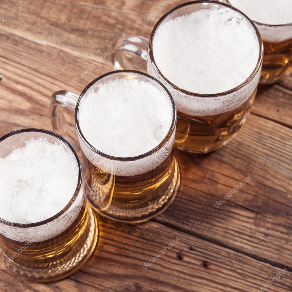 Top view of mugs of beer