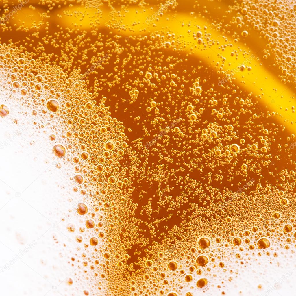 close up of beer with foam 