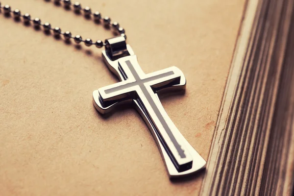 Christian cross on bible — Stock Photo, Image