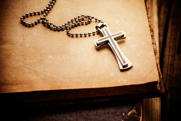 Christian cross on bible — Stock Photo, Image