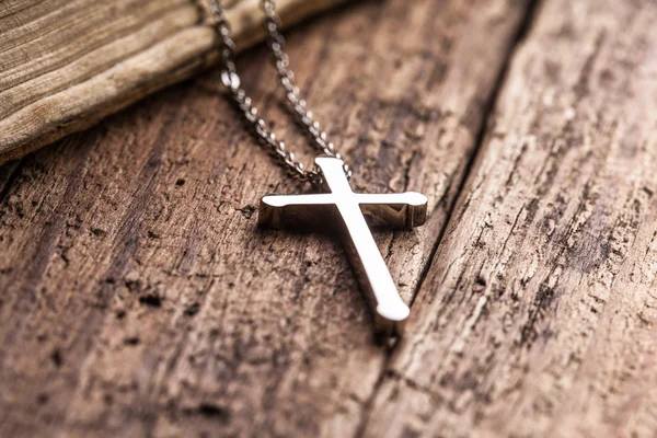 Cross on wooden background — Stock Photo, Image