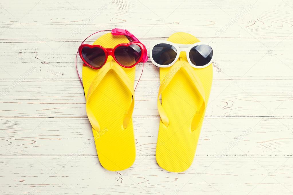 Yellow flip flops and sunglasses