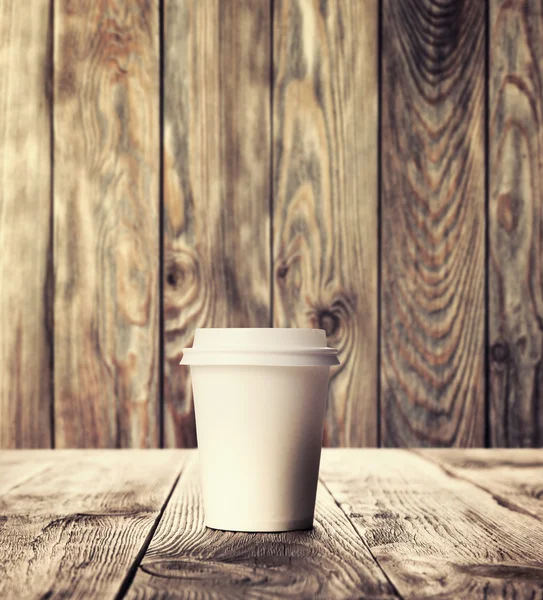 Cup of coffee on wood table — Stock Photo, Image