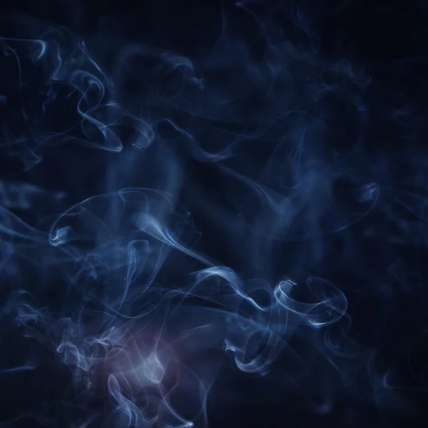 Fumée sur fond bleu — Photo
