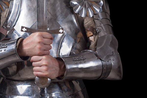 Knight wearing armor and holding two-handed sword