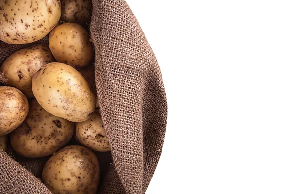 Harvest potatoes in burlap sack — Stock Photo, Image