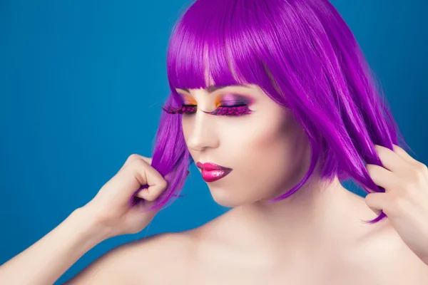 Beautiful woman wearing colorful wig — Stock Photo, Image