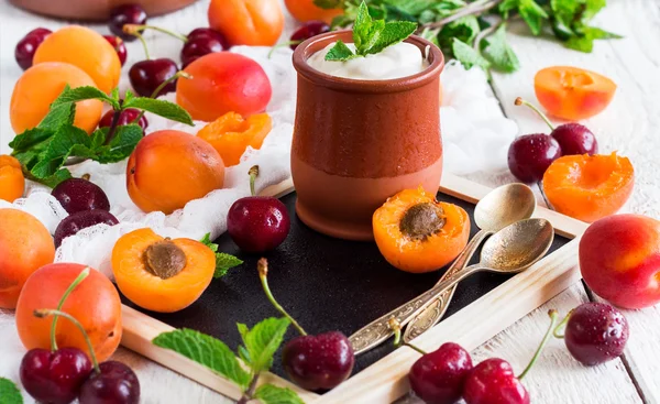 Fresh jogurt with organic ripe apricots and cherries — Stock Photo, Image