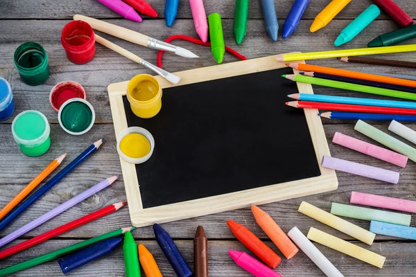 School supplies, crayons, pens, chalk — Stock Photo, Image