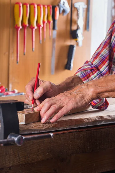 Carpenter working on the work bench, joinery tools and woodwork