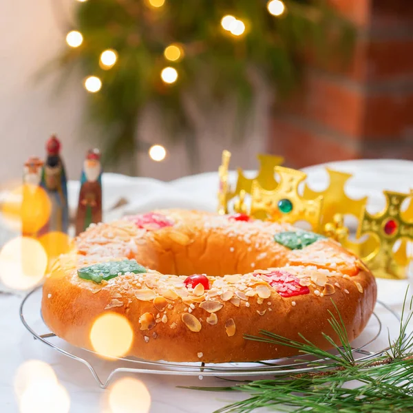 Traditional Spanish Epiphany cake, Roscon de Reyes with festive decorations