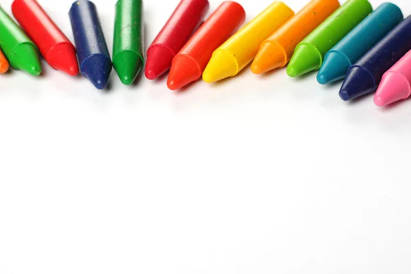 Oil pastel crayons lying on a paper — Stock Photo, Image