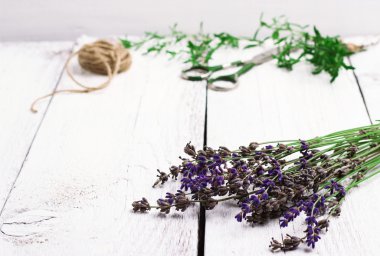 Herbs on a wooden table, savory, thyme, lavender