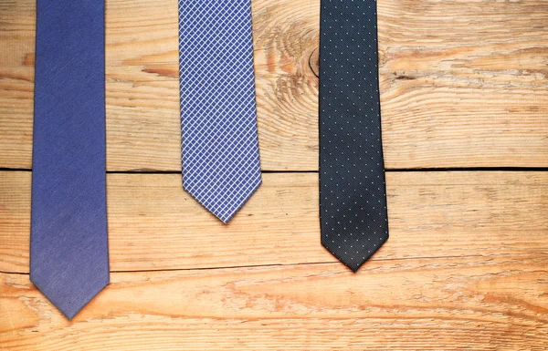Tie on a wooden table — Stock Photo, Image