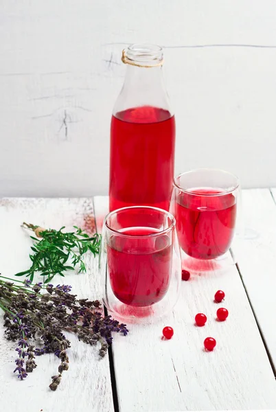 Cranberry (red berries) drink in glass