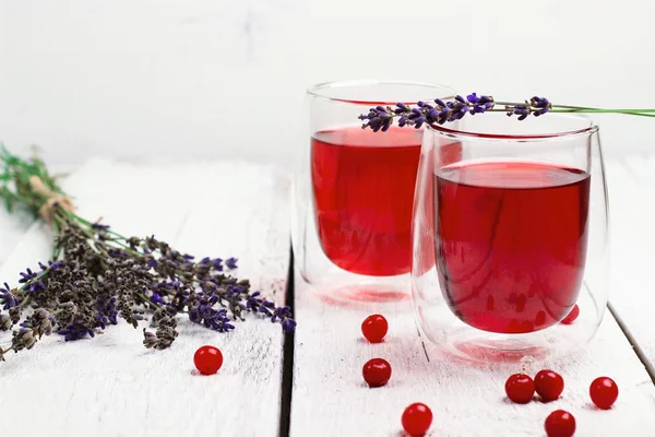 Cranberry (red berries) drink in glass — Stock Photo, Image