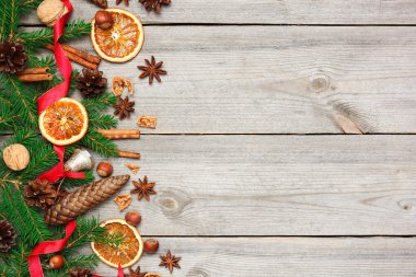 Christmas decoration with fir tree, oranges, cones, spices