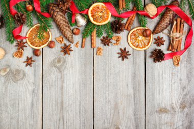 Christmas decoration with fir tree, oranges, cones, spices