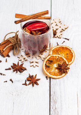 Christmas mulled wine on a white rustic wooden table