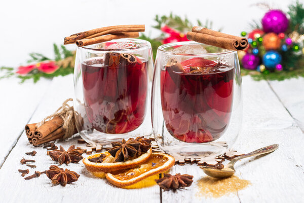 Christmas mulled wine on a white rustic wooden table