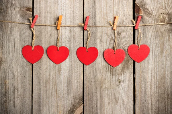 Red heart hanging on the clothesline for Valentine Day — Stock Photo, Image