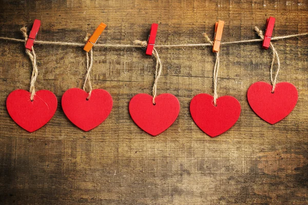 Red heart hanging on the clothesline for Valentines Day — Stock Photo, Image