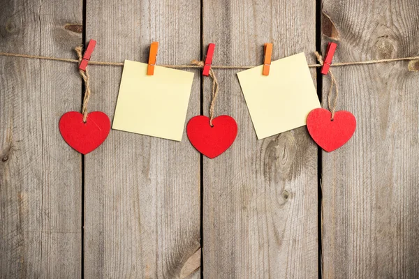 Red heart hanging on the clothesline for Valentines Day — Stock Photo, Image