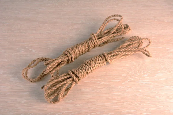 Natural jute rope, vegetable fiber woven into a thick thread close-up textured effect. Natural plant material. Hemp or linen rope.