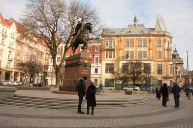 Lviv, Ukraine - January 2021: Monument to King Danylo Halytskyi in Lviv.Empty Lviv streets during COVID-19 Quarantine. clipart