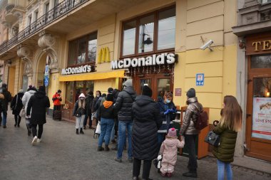 Lviv. Ukraine, January 2021.queue in McDonald Lviv.Queue near the Macdonalds in the quarantine and pandemic repield. Maintenance in takeaway mode.