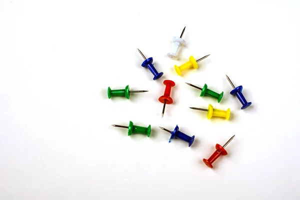 Set of colorful color push pins top view isolated on white background.Set of push pins in different colors