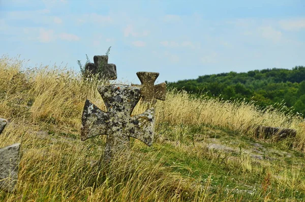 Ancient kozak cemetery with tombs and stone crosses of unknown warrior heroes of Bohdan Khmelnytsky rebellion. traditional coquina stone tombs and crosses with carved dates