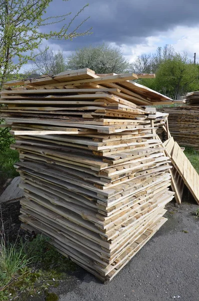 Close-up old wooden pallets.Wood pallet in factory area use for carry material and product supply to customers.Selective focus