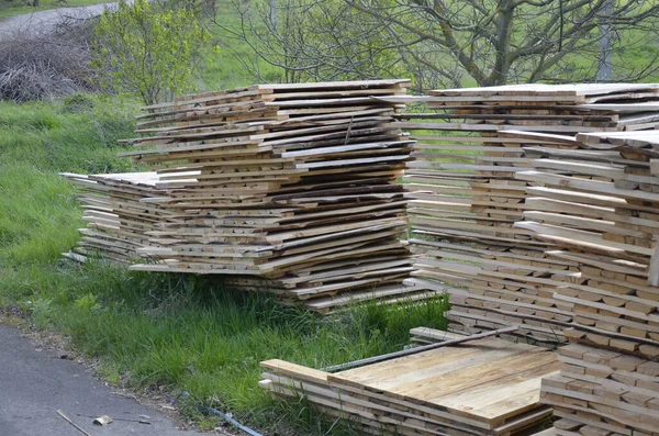 Close-up old wooden pallets.Wood pallet in factory area use for carry material and product supply to customers.Selective focus