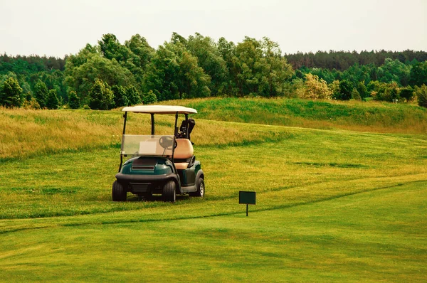 golf car with sun set in golf course.