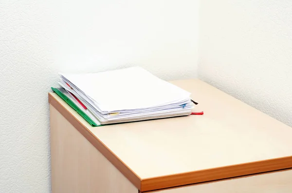 Document pile on office desk, Stack of business paper on the table with blurred of meeting room interior background. job interview and busy business concepts.