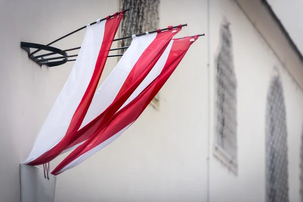 Flags on wall of building in Vienna — Stock Photo, Image