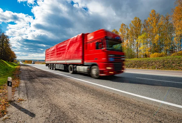 Fast moving truck on a highway in Bavaria, Germany, Europe. Transportation, freight and delivery.