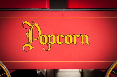 Vintage Style Yellow Popcorn Print on Red clipart