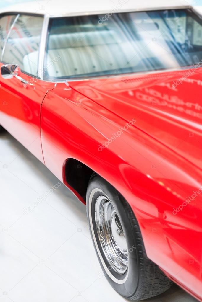 Close Up Detail of Shiny Red Classic Car.