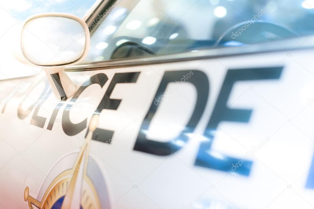 Door, window and side mirror of police car.