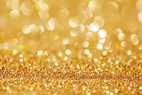 Goldener Glanz für weihnachtlichen Hintergrund mit verschwommenen Lichtern. — Stockfoto