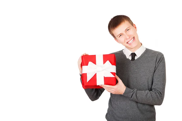 Bright picture of handsome man with a christmas gift. — Stock Photo, Image