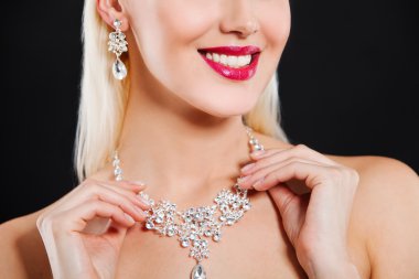 Close up portrait of a beautiful blonde girl with luxury accessories. fashion model clipart