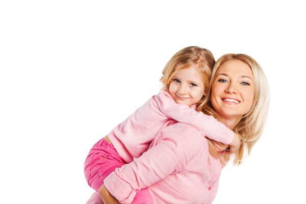 Closeup portrait of happy mother and daughter - isolated. Happy family people concept.