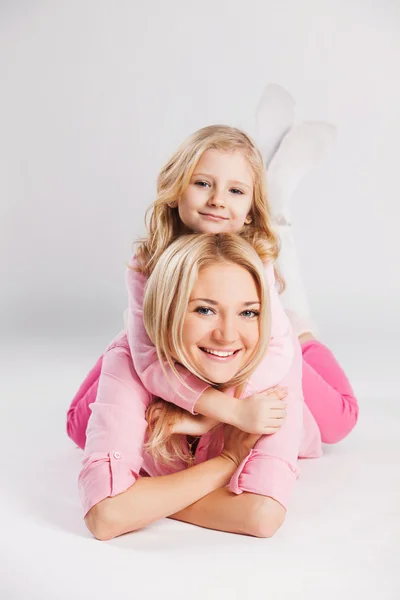 Closeup portrait of happy mother and little smiling daughter - isolated. Happy family people concept. — Stock Photo, Image