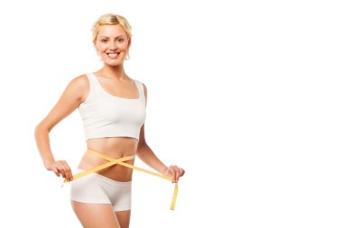 mutlu genç kadın üzerinde beyaz bir ölçüm bandı ile